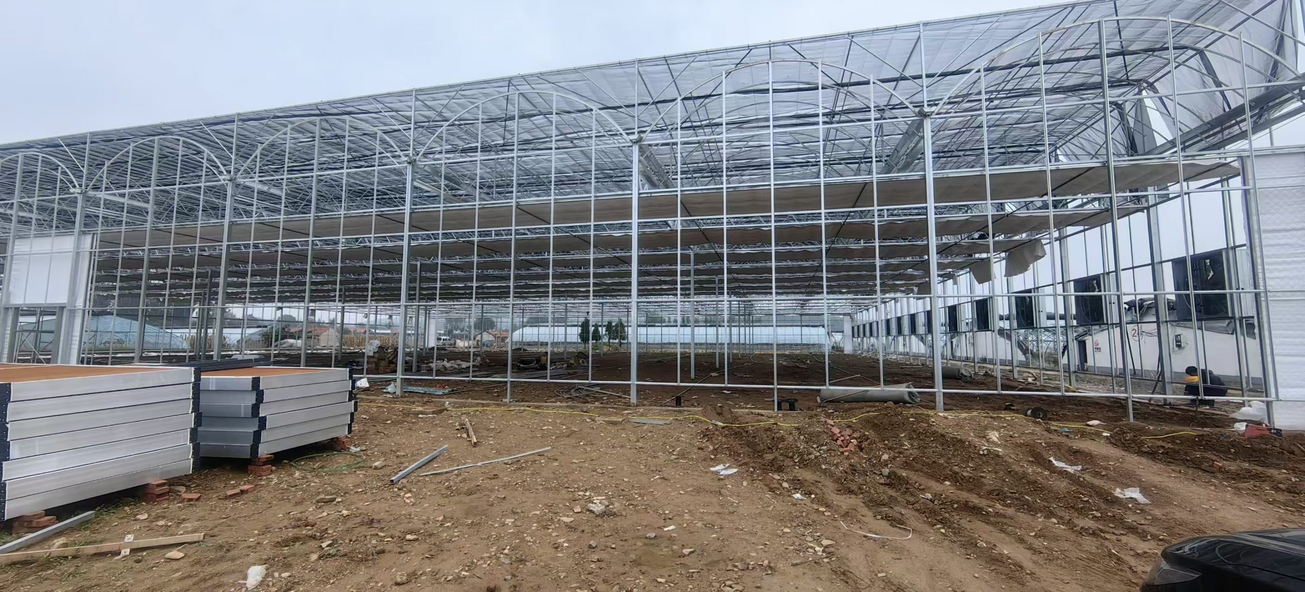 Film-covered multi-span greenhouse